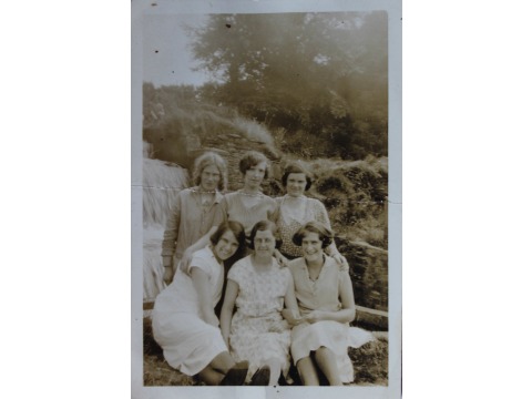 Clucas' laundry girls. May Kermode from Baldwin is standing on the left, back row; Edith Humphries from Cronkbourne Village, Braddan is standing in the middle, back row; Nellie Corlett from Cronkbourne Village, Braddan is sitting on the left, front row. 