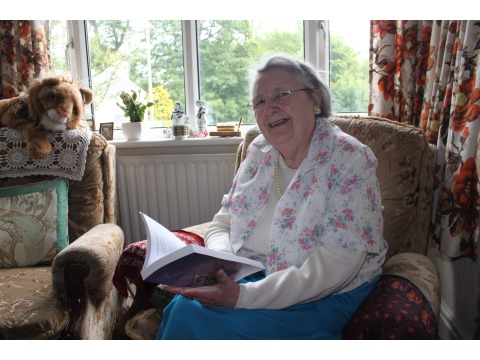 Mrs Violet Corlett at her home in Douglas in 2011 holding one of her published books 'Shades of Violet'