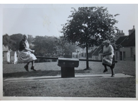Cronkbourne Village, Braddan playground and green. Mrs Kerruish is on the right and Mrs Humphries is on the left. Date unknown. 
