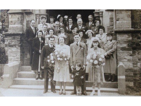 Mrs Violet Corlett and her husband Allan on their wedding day on the 2nd October 1951 outside Braddan Church. Mrs Corlett's sister Margaret was the bridesmaid and is standing on the right front row. 