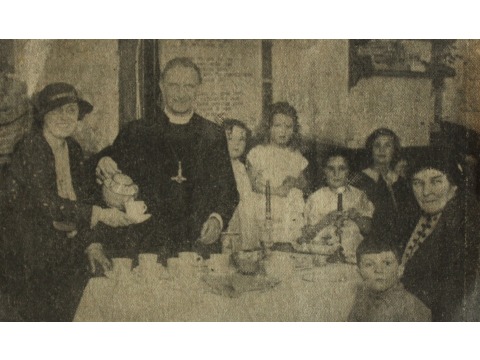 Newspaper cutting with photograph of a Boxing Day Party with Bishop Stanton Jones. Mrs Joyce Kinley, as a young child, is standing in the centre of the photograph (second child from the left after Bishop Stanton Jones). Date unknown