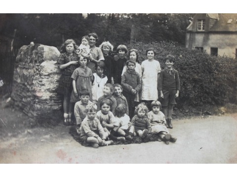 Group of Cronkbourne Village children outside one of the houses in Cronkbourne Village, Braddan. Date unknown.