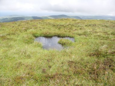 Look for the water-filled hollows which are where round houses once stood.