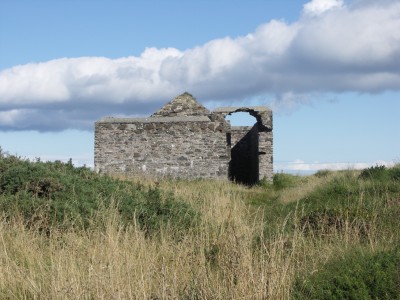 The explosives store with its typical double wall for blast protection.